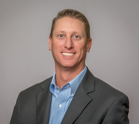 A headshot of Daniel Leigh